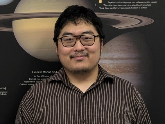 Eonho Chang  holding 2025 Research Prize Plaque